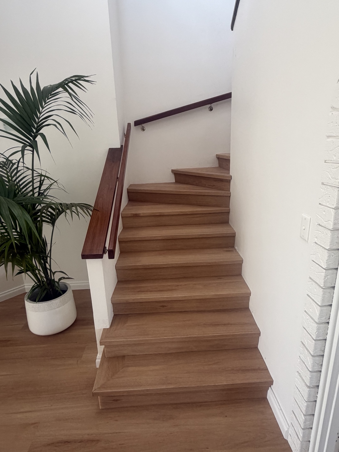 Finished vinyl plank stair treads and risers in Ocean Reef