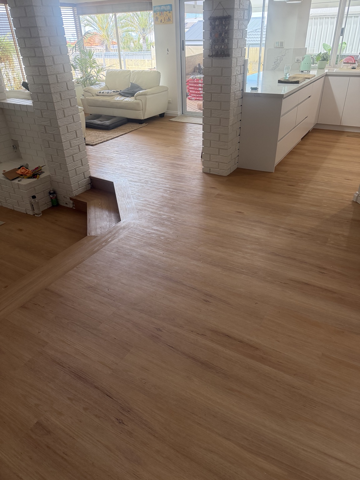 Ocean Reef living and kitchen areas with completed timber-look vinyl plank flooring