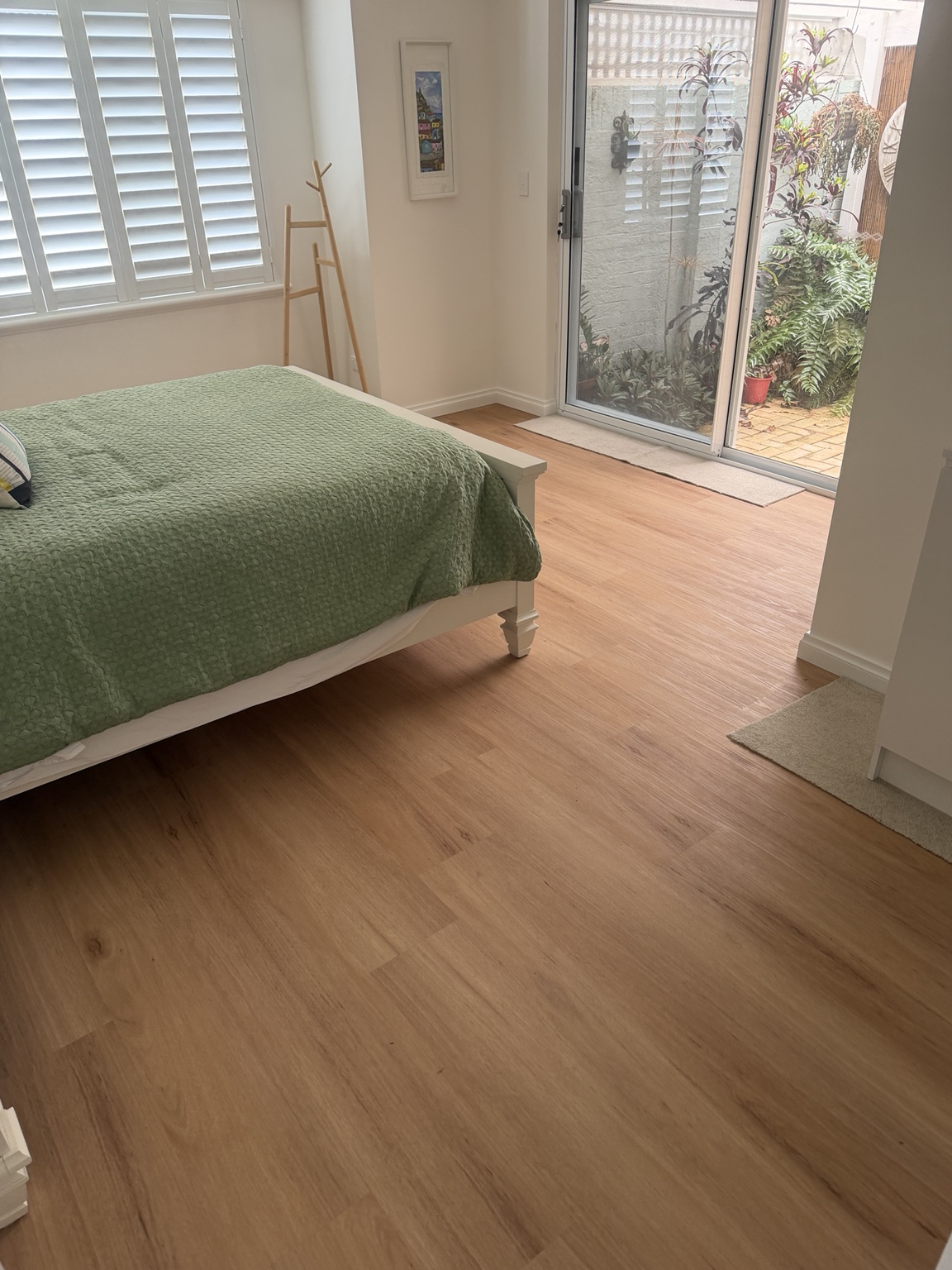 5 mm vinyl plank flooring in a furnished Ocean Reef bedroom