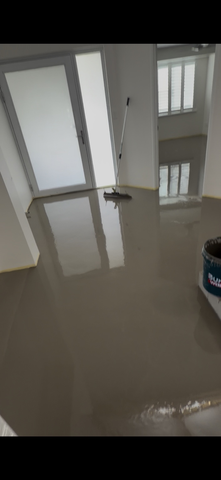 Wet floor-levelling preparation in the Ocean Reef home